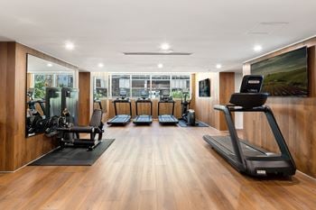 Fitness center with treadmills and strength equipment